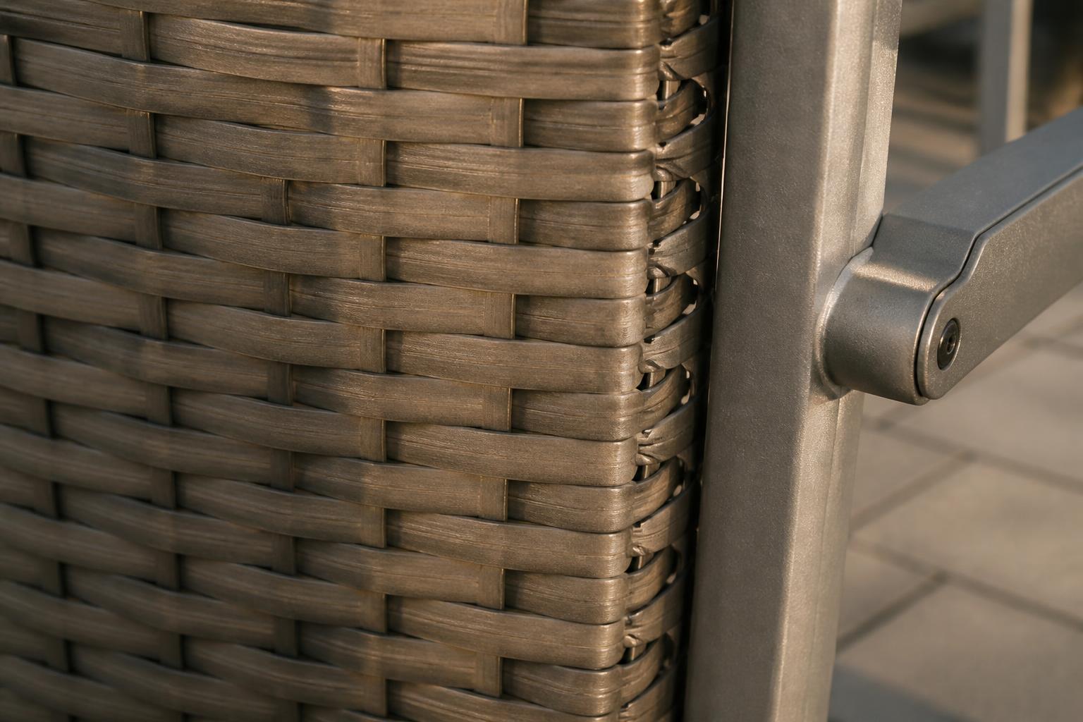 Close-up of synthetic wicker weave and aluminum frame joint