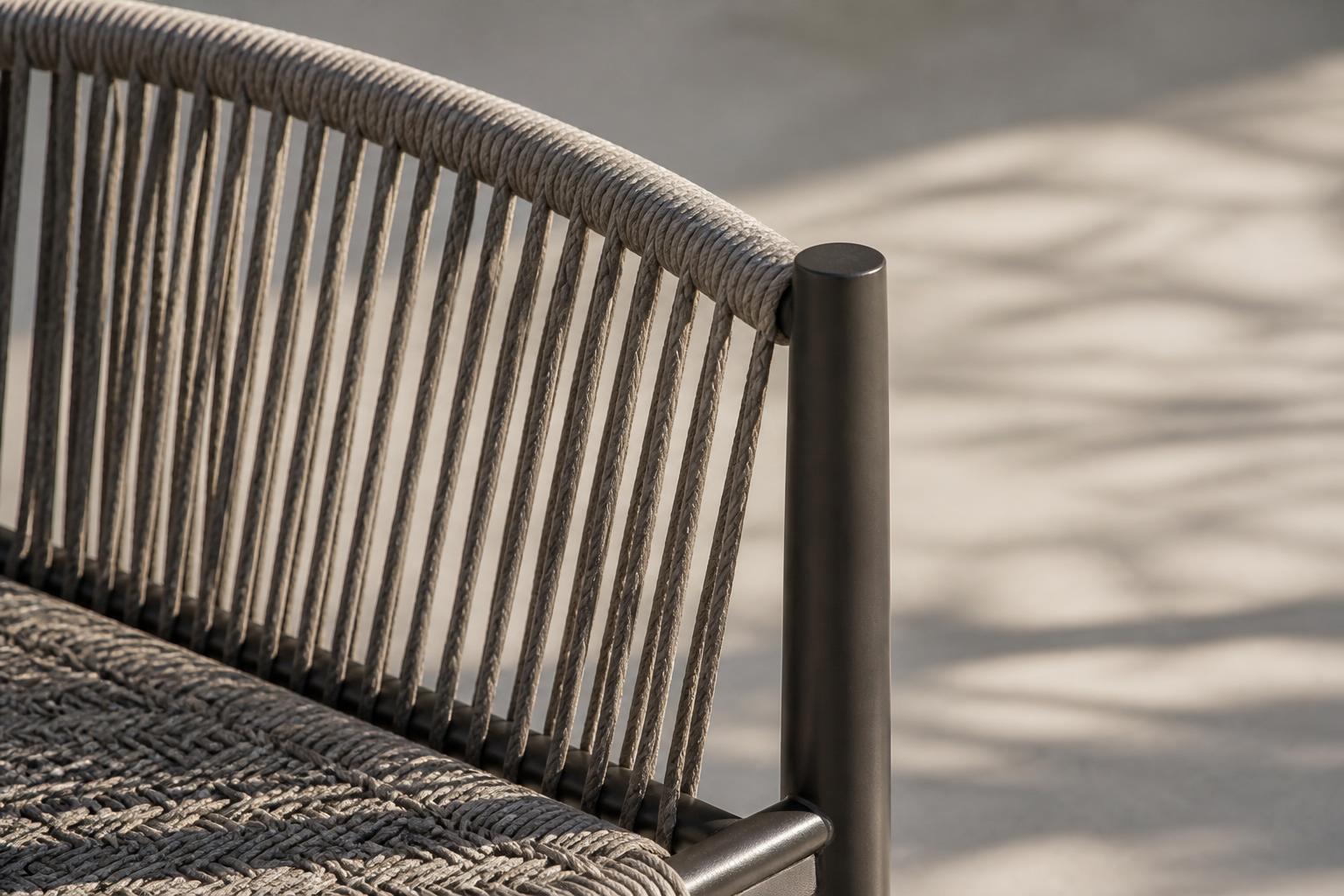Close-up of a rope-woven outdoor dining chair's cord weave