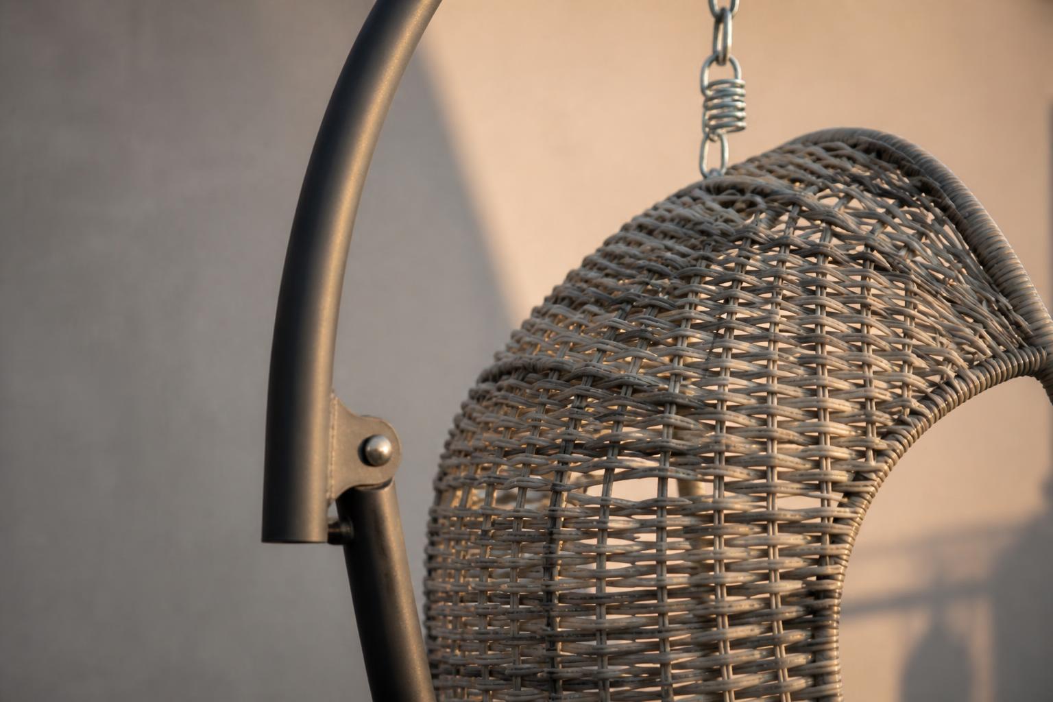 Close-up of a hanging egg chair's woven resin texture