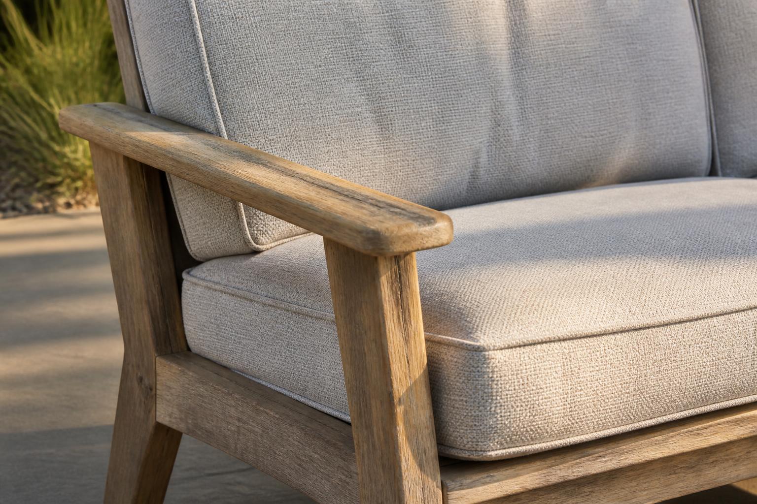 Close-up of an outdoor loveseat's frame and cushion seam